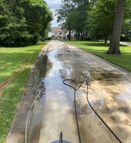 A driveway being cleaned